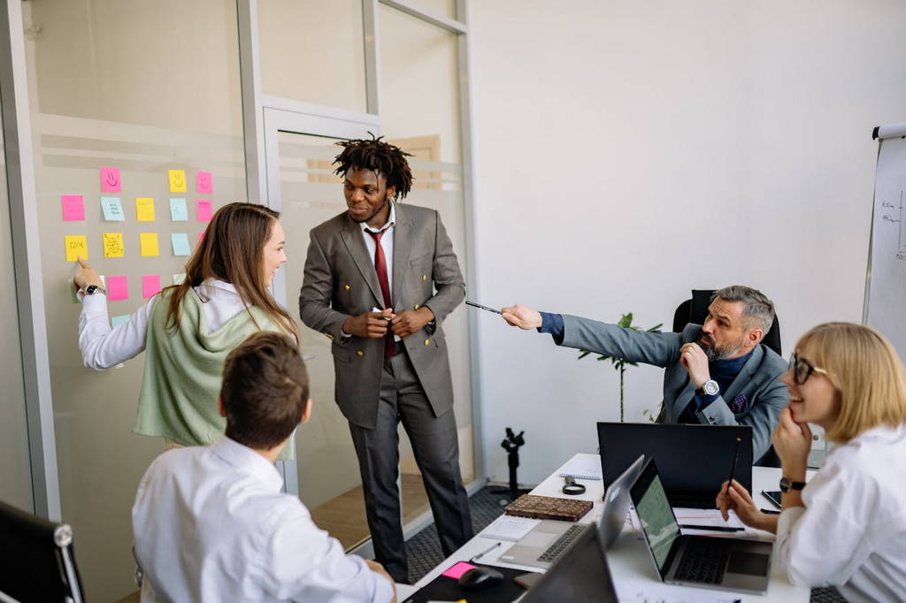 A dynamic team meeting with active collaboration, brainstorming, and leadership engagement.